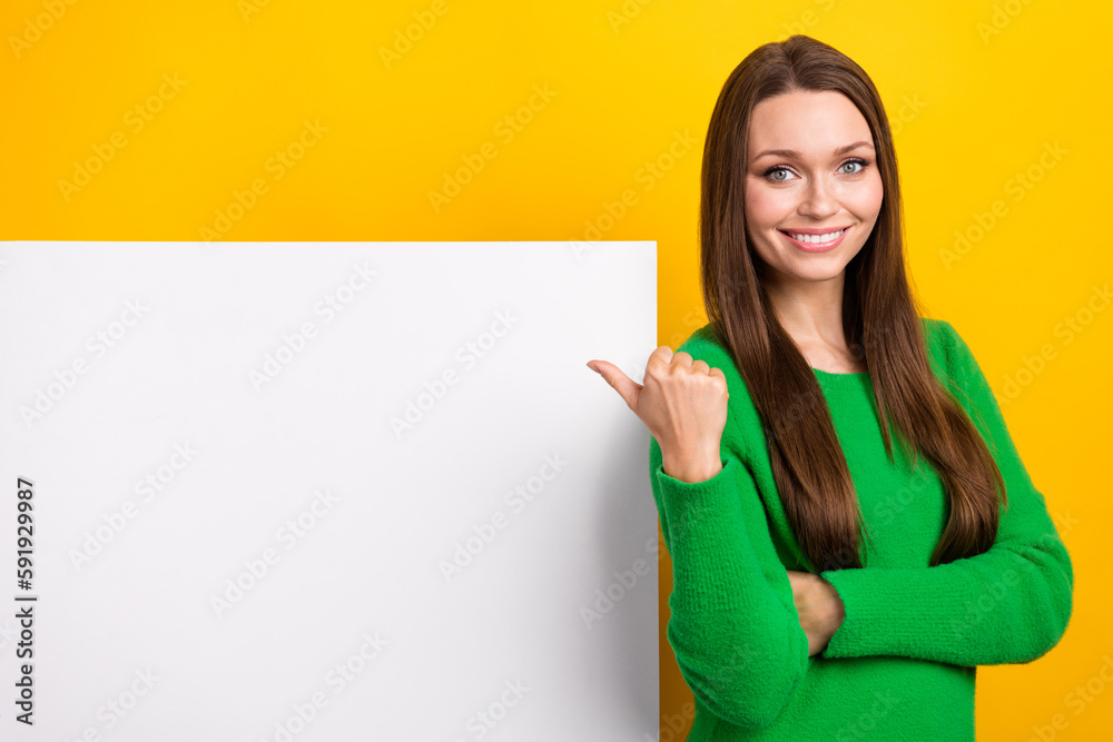 Photo of positive lovely lady direct finger empty space offer blank isolated on yellow color background Photo of positive lovely lady direct finger empty space offer blank isolated on yellow color background