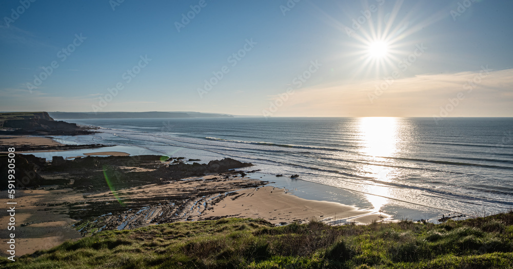 Landscape image of Cornish beach in Summertime at sunset