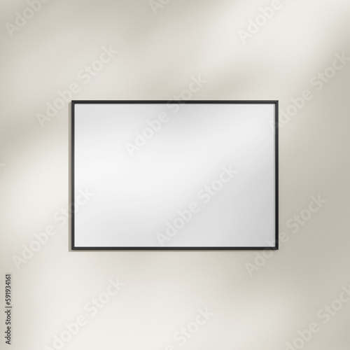 Frame hanging on a white wall mockup with leaf shadow
