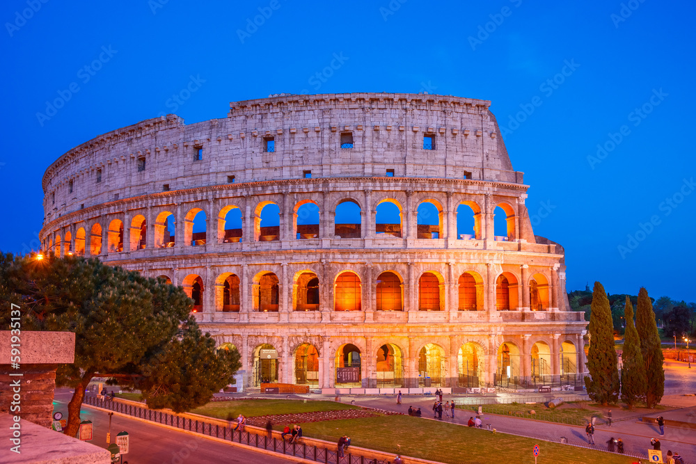 Colorful view of the Colosseum in the blue hour, Rome  Italy.