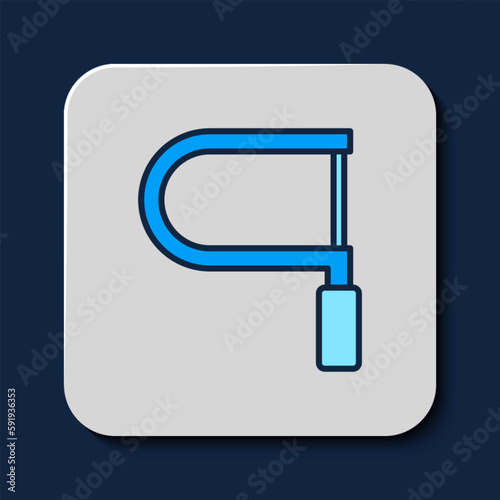 Filled outline Hacksaw icon isolated on blue background. Metal saw for wood and metal. Vector