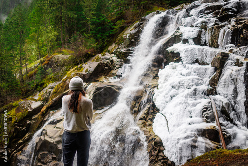 hiker watching waterfall © Jef