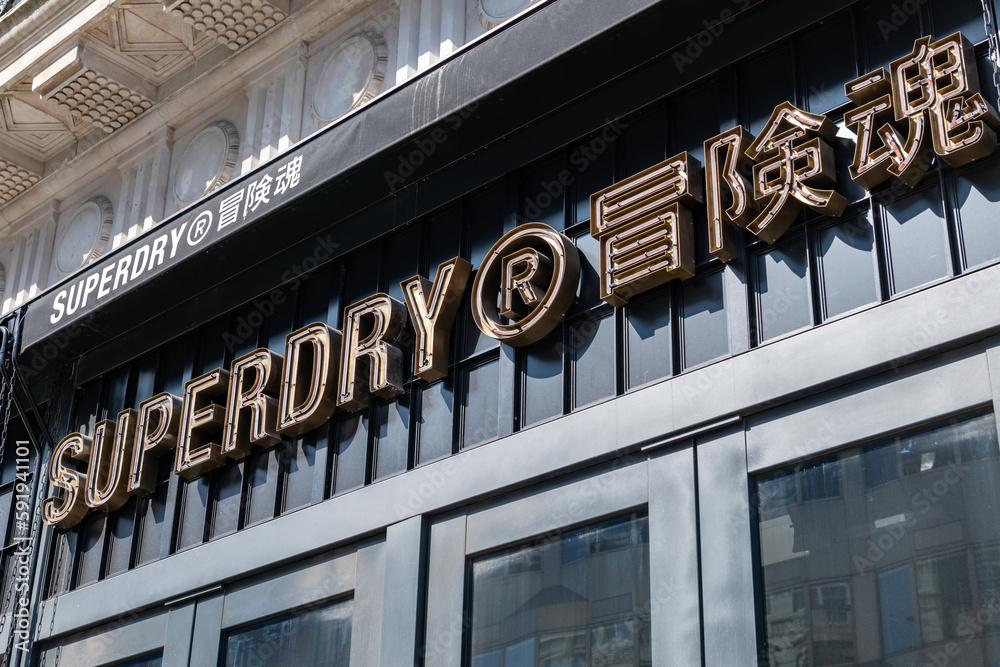 London. UK- 04.09.2023. The facade of the Superdry retail store on Oxford  Street showing the company name sign and logo. Stock Photo | Adobe Stock