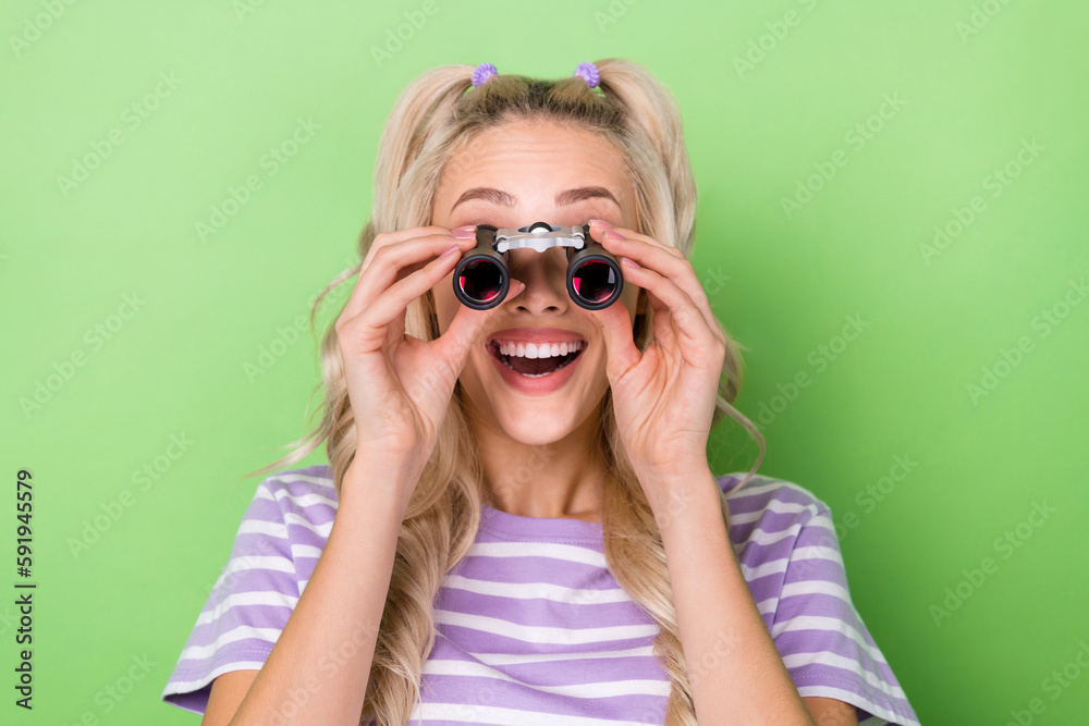 Photo of funky impressed lady dressed purple t-shirt making investigation magnifying binoculars isolated green color background