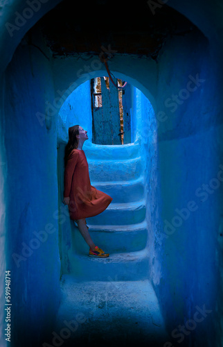 woman with orange dress in Chefchaouen IV © livcool