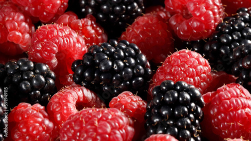 closeup on raspberries and blackberries