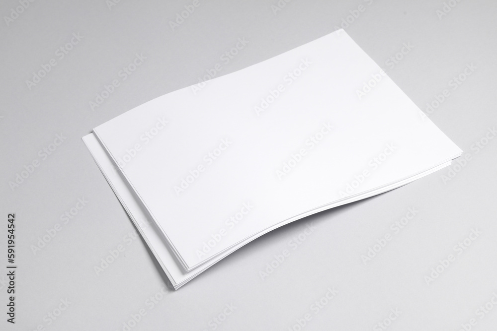 A4 white blank sheets of paper on a gray background. Template for design A4 white blank sheets of paper on a gray background. Template for design
