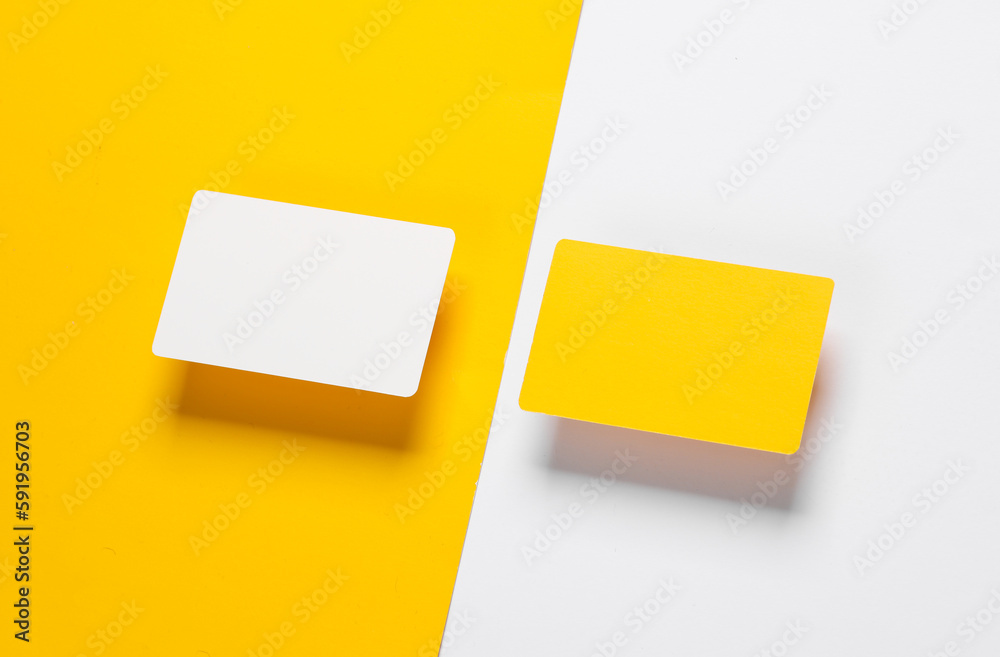 white and yellow blank plastic bank cards on a colored background