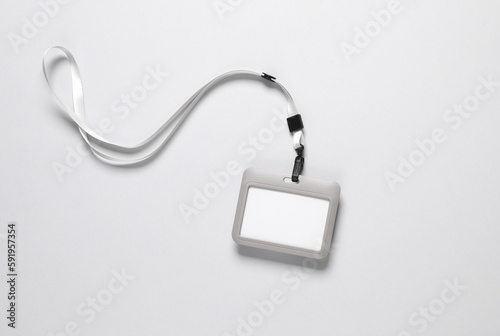 Id card badge with belt on gray background
