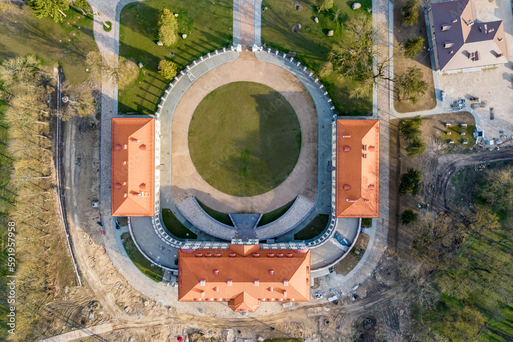 aerial view on overlooking restoration of the historic castle or palace near lake