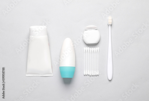 Objects for personal hygiene on a gray background. Flat lay