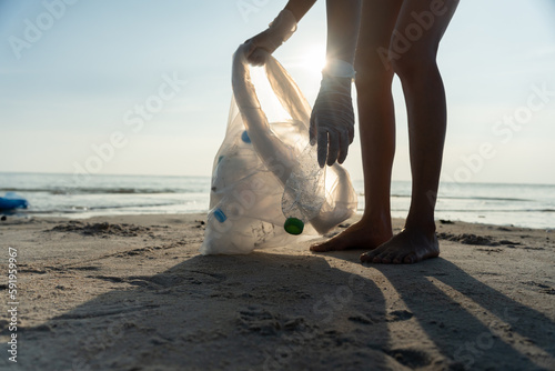Save water. Volunteer pick up trash garbage at the beach and plastic bottles are difficult decompose prevent harm aquatic life. Earth  Environment  Greening planet  reduce global warming  Save world