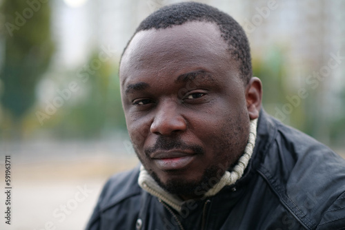 African american man from Nigeria looks at camera