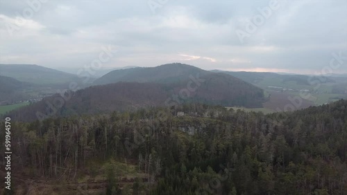 Aerial shot of scenic wild nature. Forests, fields, meadows. mountains in the distance in a haze
