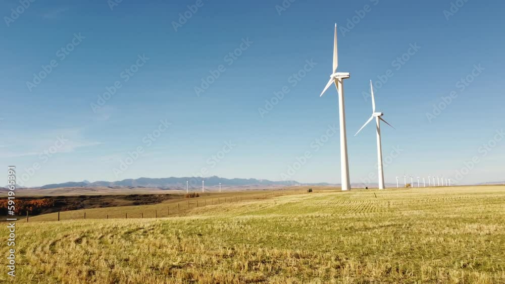 Pincher Creek Alberta Canada, October 17 2022: Vestas Windmills tracking shot overlooking harvested agriculture fields and a wind farm.
Pincher Creek Alberta Canada, October 17 2022: Vestas Windmills tracking shot overlooking harvested agriculture fields and a wind farm.