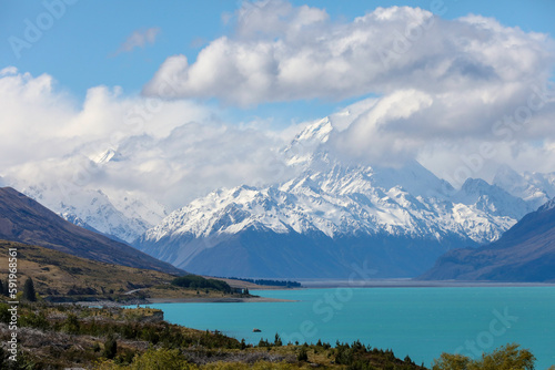 The magnificent, snow-covered Aoroki or Mount Cook, the highest mountain in New Zealand, is seen from an azure Lake Pukaki © Colin N. Perkel