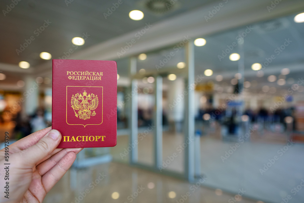 Man holding passport of Russian Federation. Man holding passport of Russian Federation.