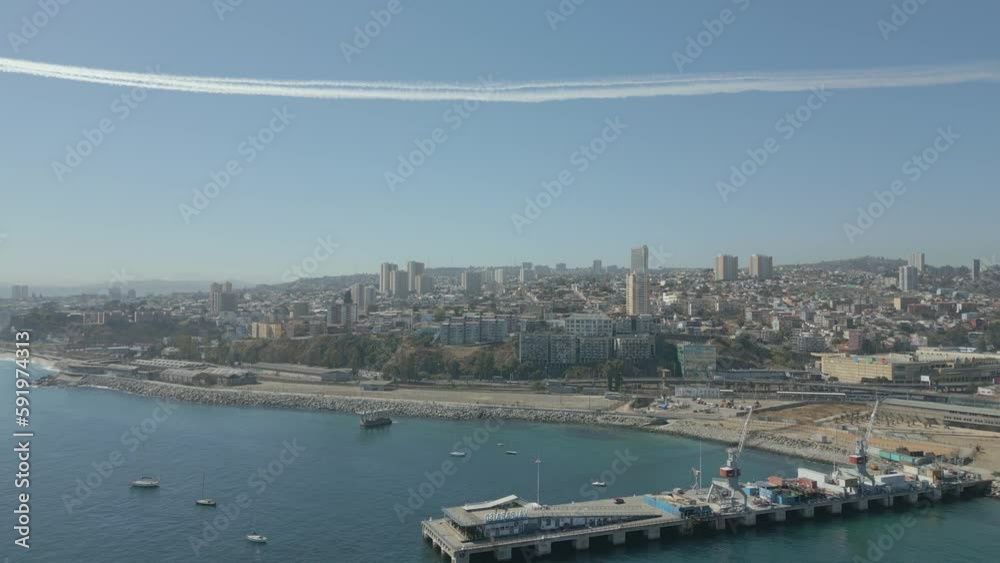 Aerial view of a port with airplanes flying in the sky Aerial view of a port with airplanes flying in the sky
