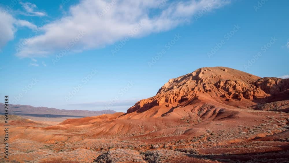 Unusual red rocks in a desert arid area. Timelapse. Canyon in the Boguty mountains. Kazakhstan Unusual red rocks in a desert arid area. Timelapse. Canyon in the Boguty mountains. Kazakhstan