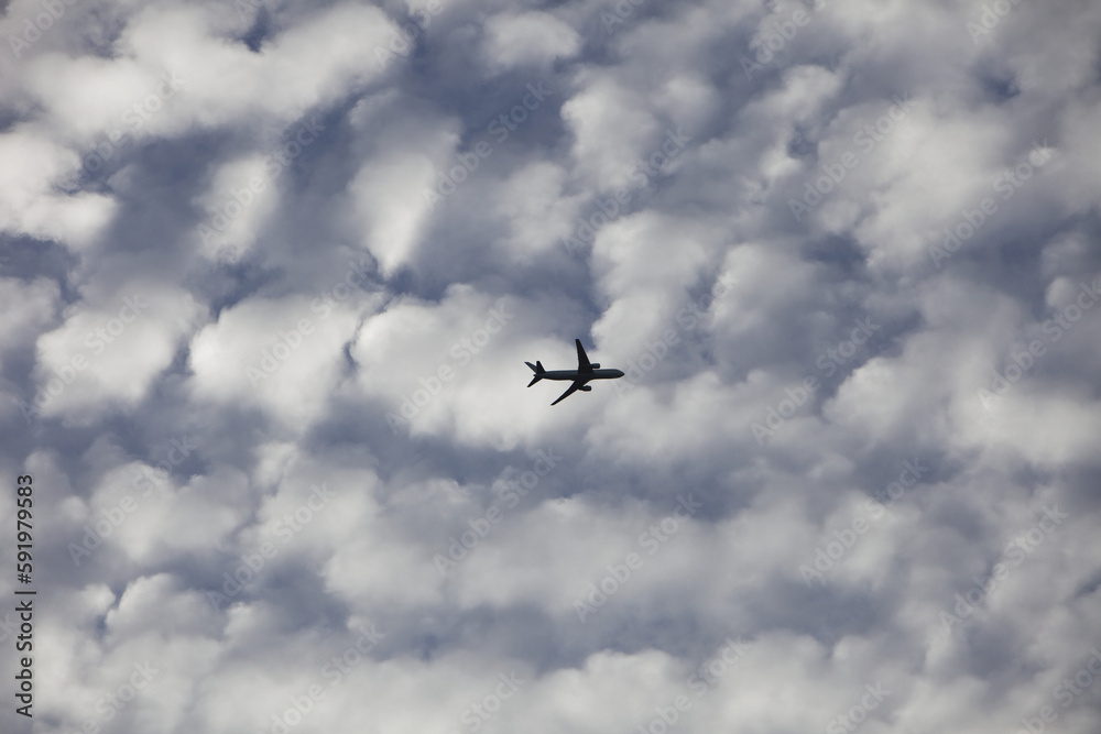 Commercial aircraft in the clouds; Brampton, Ontario, Canada Commercial aircraft in the clouds; Brampton, Ontario, Canada