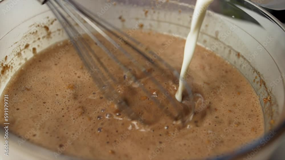 Close up chef melts milk and chocolate in the bowl. Bunet typical Piedmontese sweet preparation.Super slow motion 4K Close up chef melts milk and chocolate in the bowl. Bunet typical Piedmontese sweet preparation.Super slow motion 4K