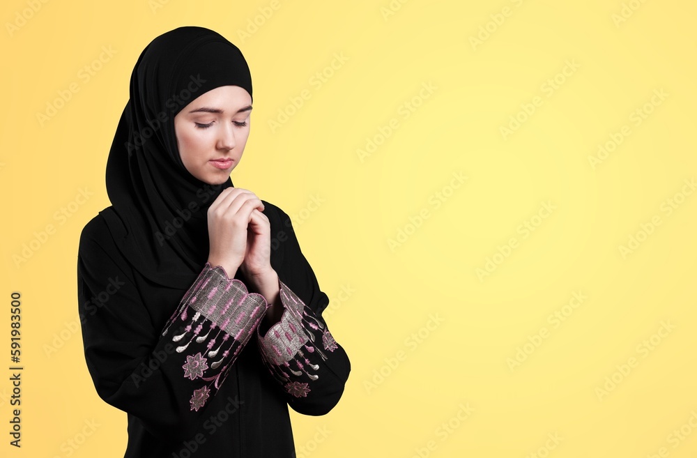 Young Muslim woman greeting on the background Young Muslim woman greeting on the background