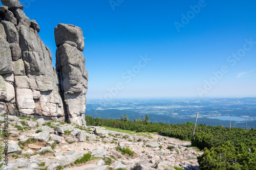 Granite rock in poland part of Giant mountains Krkonose called Słonecznik, sunny summer touristic season with blue sky photo