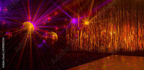 disco background with disco balls in purple and gold lighting