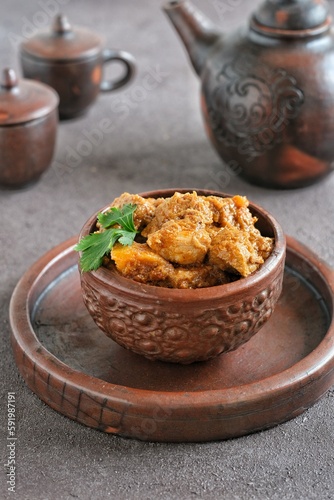 chicken rendang in bowl on the table, Indonesian food photo