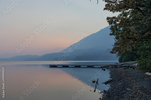 Dock in the tranquil water of Cultus Lake in Cultus Lake Provincial Park; Cultus Lake, British Columbia, Canada