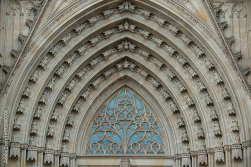 Architectural detail of the arch work and tracery above the main entrance of the Catedral de Barcelona; Barcelona, Spain photo