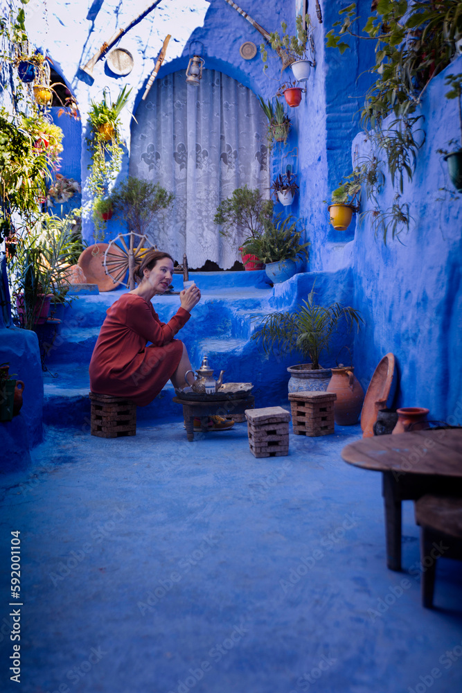 woman with orange dress in Chefchaouen VI woman with orange dress in Chefchaouen VI