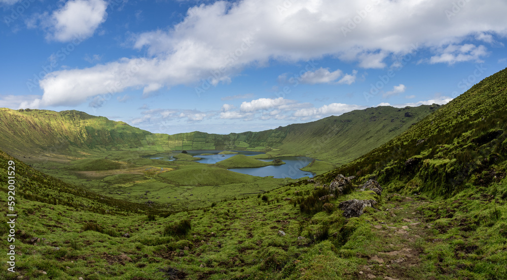 Panoramic view of Caldeirão, the ex-libris of Corvo Island. The clouds in the sky enhance this natural wonder.
Portugal. Panoramic view of Caldeirão, the ex-libris of Corvo Island. The clouds in the sky enhance this natural wonder.
Portugal.