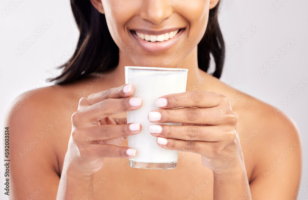 Woman with smile, glass of milk in hands and health with nutrition, vitamins and calcium on studio background. Organic, healthy lifestyle and wellness with happy female, diet and dairy product Woman with smile, glass of milk in hands and health with nutrition, vitamins and calcium on studio background. Organic, healthy lifestyle and wellness with happy female, diet and dairy product