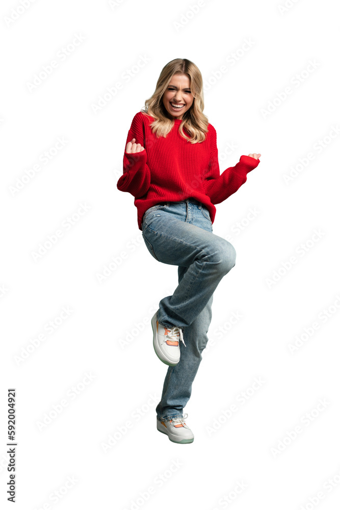 Full length portrait of a joyful young woman jumping and celebrating over transparent background