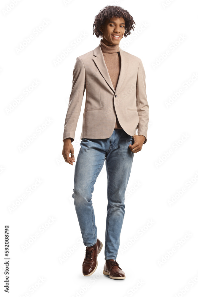 Young elegant african american man in a beige suit and jeans posing Young elegant african american man in a beige suit and jeans posing
