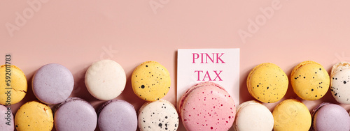 pink tax concept. big pink dessert and small desserts on beige background. comparison style. banner