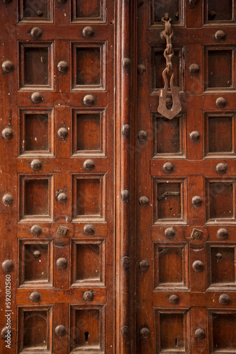 Old-fashioned wooden door with decorative rivets; Stone Town, Zanzibar