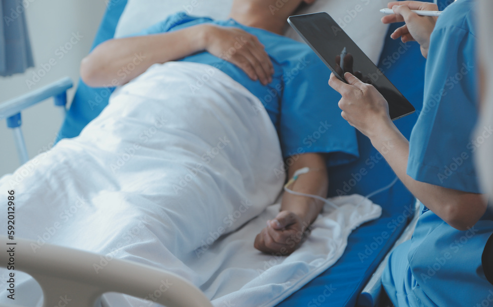Women Asian doctors hold the patient hand and encourage and provide medical advice While checking the patient health in bed. Concept of Care and compassion, antenatal care, Threatened abortion