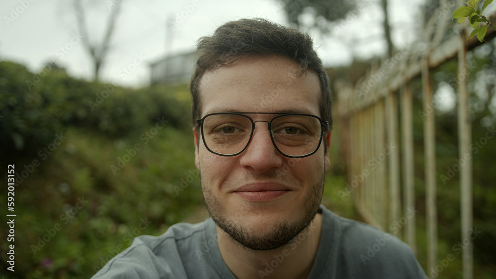 Handsome Brown-Haired Man Engaged in a Video Conference, Looking Directly at the Camera and Listening Attentively - POV Shot Handsome Brown-Haired Man Engaged in a Video Conference, Looking Directly at the Camera and Listening Attentively - POV Shot