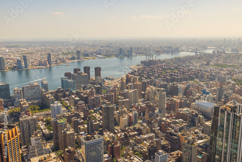 Fototapeta Naklejka Na Ścianę i Meble -  Beautiful aerial view of buildings against backdrop of landscape of Hudson River in Manhattan. New York, USA.