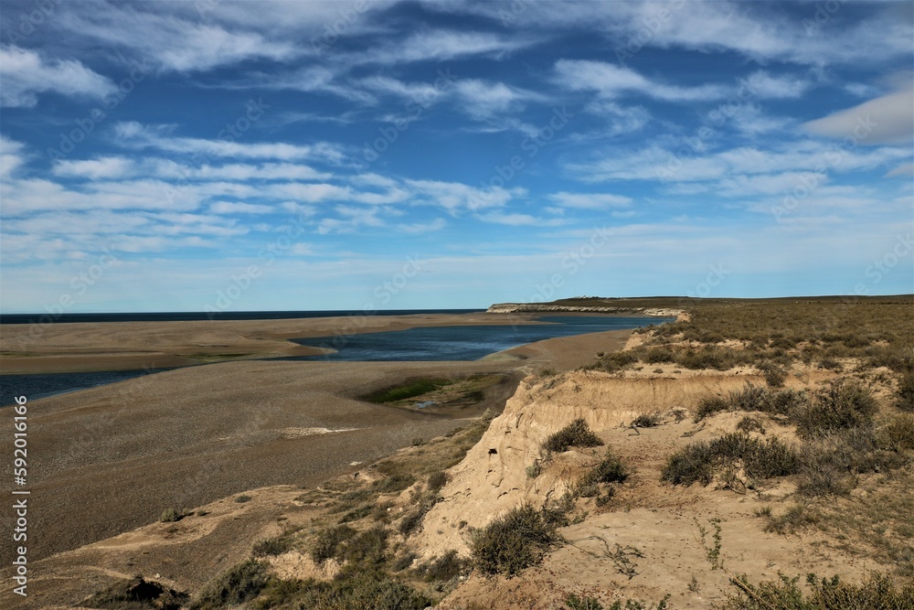 coastal landscape of the Valdes peninsula in Argentina with cloudy blue sky
