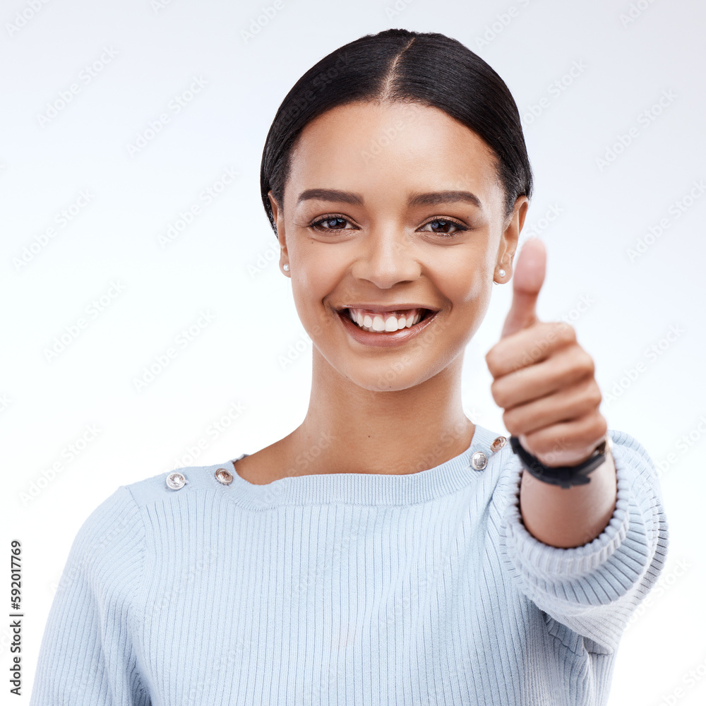 Portrait, thumbs up and motivation with a woman on a white background in studio for feedback or success. Winner, emoji or hand gesture with an attractive young female saying thank you to show support Portrait, thumbs up and motivation with a woman on a white background in studio for feedback or success. Winner, emoji or hand gesture with an attractive young female saying thank you to show support