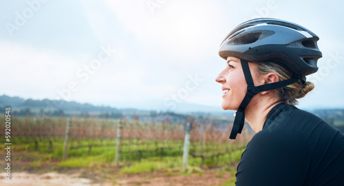 Happy, fitness and woman relax while cycling in the countryside, smile and resting in nature. Cheerful, sports and female cyclist on break in Mexico for travel, vacation or cardio, routine or workout
