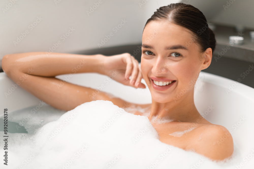 Beauty Portrait Of Pretty Female Taking Bath With Foam Indoors Beauty Portrait Of Pretty Female Taking Bath With Foam Indoors