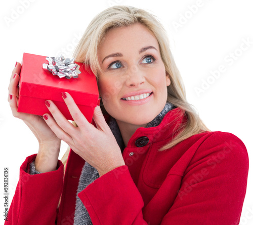 Festive blonde holding red gift 