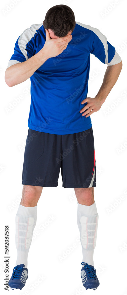 Disappointed football player looking down Disappointed football player looking down