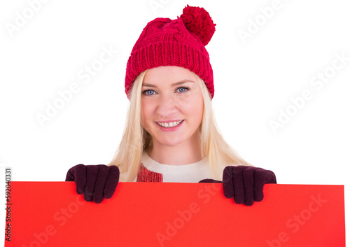 Festive blonde showing a red poster