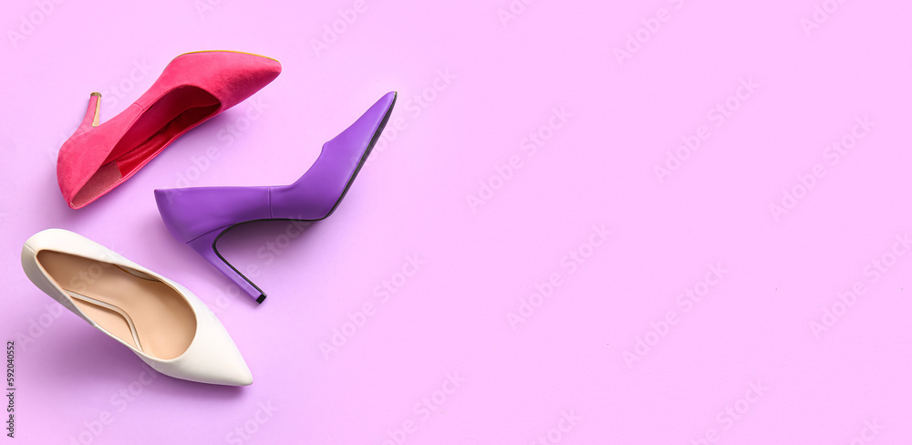 Fashionable high heeled shoes on lilac background with space for text Fashionable high heeled shoes on lilac background with space for text