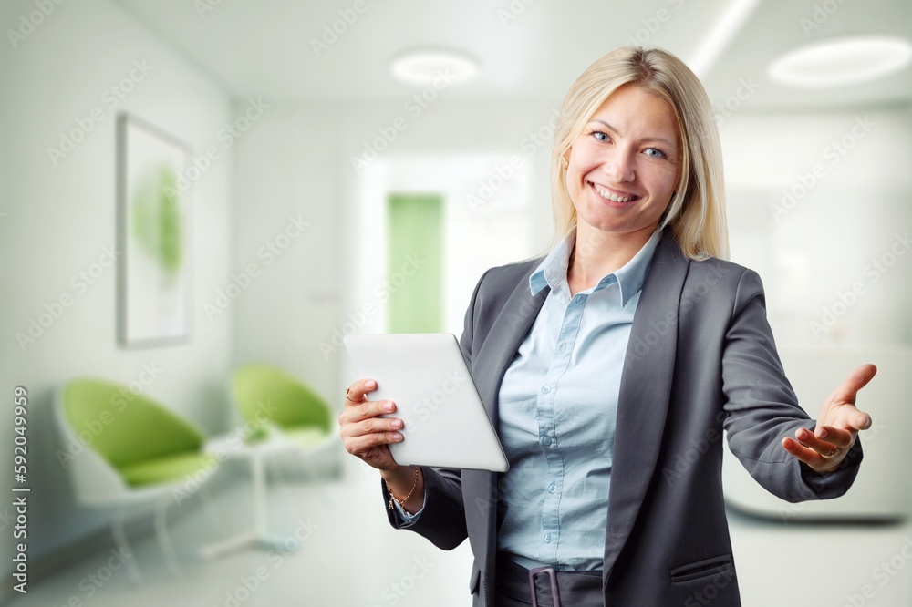Young smiling business woman with digital tablet Young smiling business woman with digital tablet
